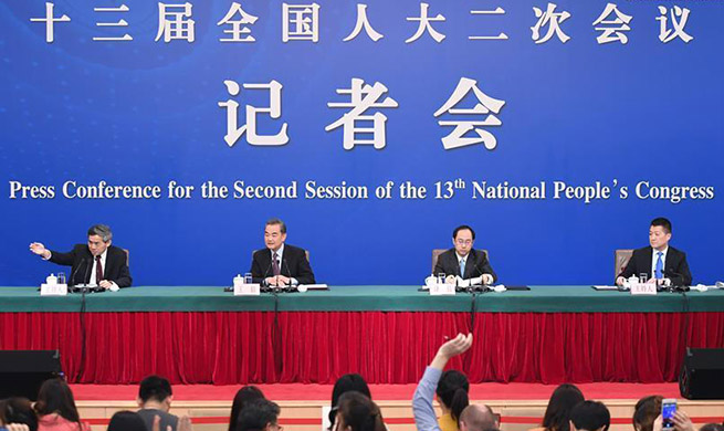 Chinese state councilor, FM meets press on foreign policy