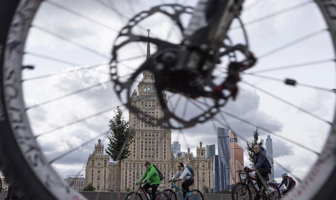 People ride bicycles during Moscow Autumn Cycling Festival