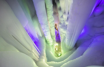 Tourists visit ice cave in Luyashan scenic area, north China's Shanxi